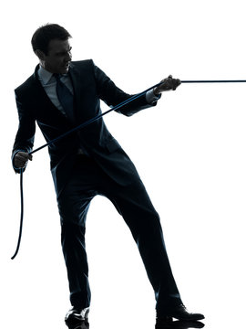 Business Man Pulling A Rope Silhouette