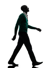 Fototapeta na wymiar african black man walking looking up smiling silhouette silhouet