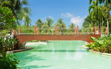 Wooden bridge over the swimming pool.