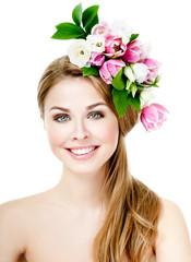 Smiling beautiful woman with flowers in her hair