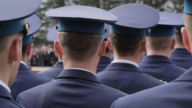 Formation of soldiers in dress parade uniform.