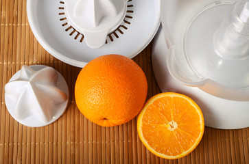 Fruit juicer and oranges