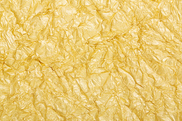 Golden foil crumpled background texture