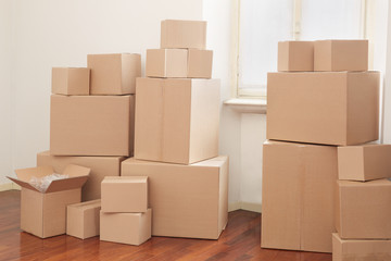 Cardboard boxes in apartment, moving day