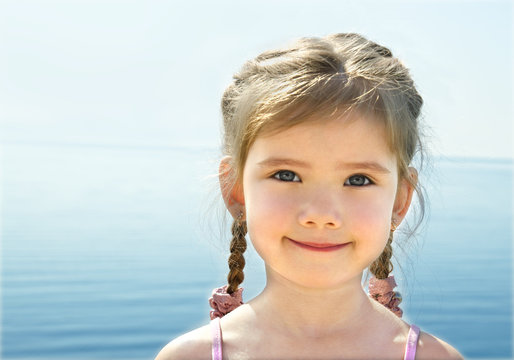 Adorable little girl on beach vacation