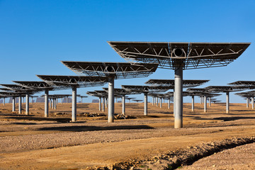 Solar panels on bright blue sky background