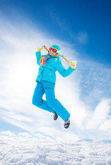 Fototapeta na wymiar Girl jumping in snow