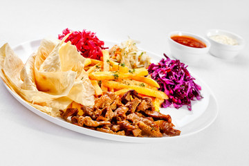 A Tasty food . Grilled meat with French fries. High quality imag