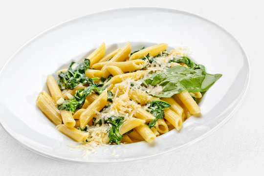 Tasty food. Pasta with vegetables over white background.