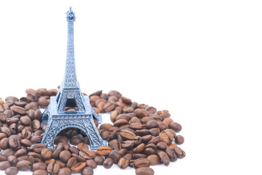 Fototapeta Eiffel Tower and coffee beans isolated on a white backgrounds
