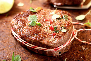 Thick juicy grilled lean beef steak medallions