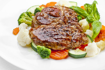 A Tasty food .Grilled steaks and vegetables. High quality image