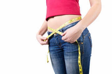 Woman measuring her waist