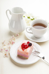 beautiful pink berries pastry, little cake with tea