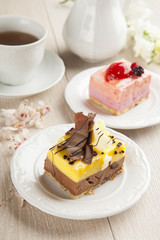beautiful pastry, little colorful sweet cakes with tea