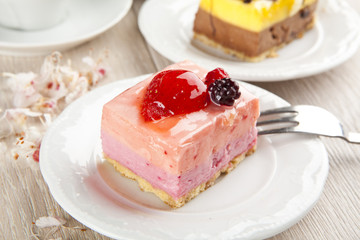 beautiful pastry, little colorful sweet cakes with tea