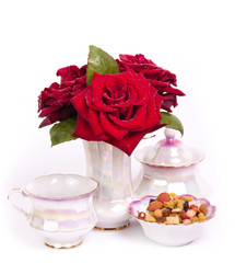 Obraz na płótnie Canvas Vintage teacup with flowers on white background