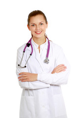 Fototapeta premium Young nurse standing with folded arms