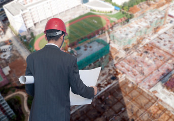 architect looking comparing housing project