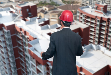 architect looking comparing housing project