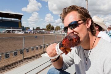 Man Eating a Turkey Leg