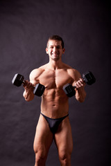 Fototapeta na wymiar young bodybuilder traininig