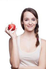 Healthy lifestyle. Beautiful brunette holding apple