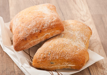 ciabatta with cheese on a wooden table 