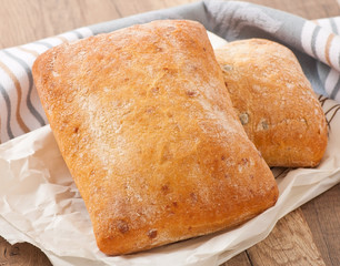 ciabatta with cheese on a wooden table 