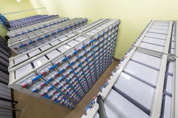 Printed roller blinds Industrial building Rows of batteries in industrial backup power system.