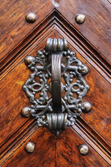 an old wood door with metal handle