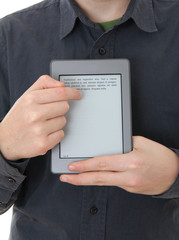 Man holding E-book reader in hands