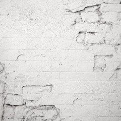 damaged white brick wall