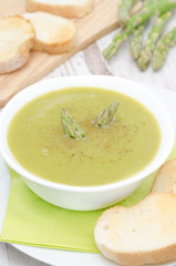 cream soup of asparagus and green peas vertical