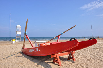 empty beach with guard tower and rescue boat in Rimini