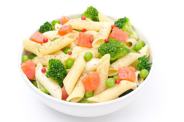 salad with pasta, smoked salmon, broccoli, green peas isolated