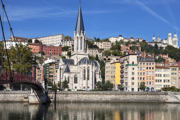 View of Lyon city with red footbridge