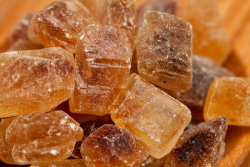 brown caramelized sugar on wooden background