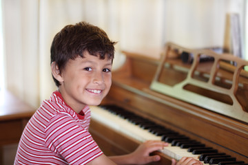 Young boy playing piano