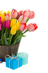 tulip flowers in wooden pot with gift boxes