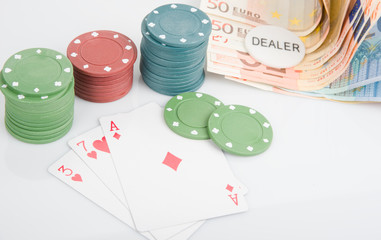 Playing cards and poker chips with money