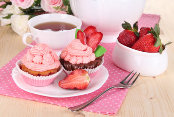 Beautiful strawberry cupcakes and flavored tea