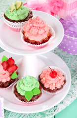 Delicious beautiful  cupcakes on festive table close-up