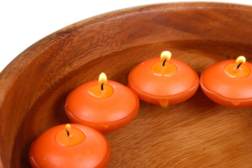 Beautiful candles in water close-up