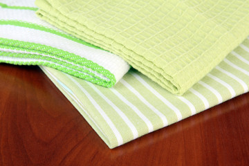 Kitchen towels on wooden background