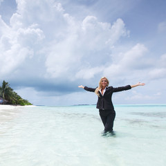 happy business woman on the ocean coast