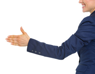Obraz premium Closeup on smiling business woman stretching hand for handshake