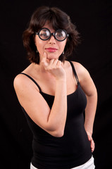 Uncertain geeky young woman thinking and seeking the solution to