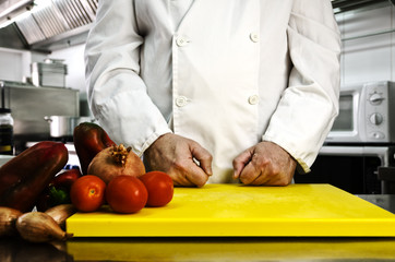 Chef hands cutting vegetables
