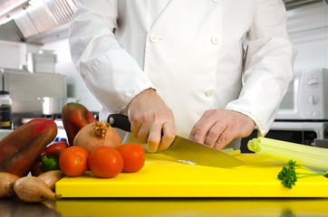 Chef hands cutting vegetables